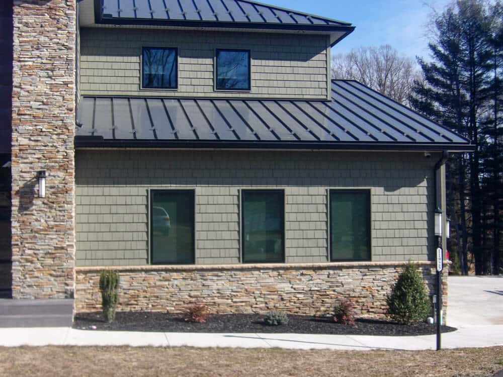 Home with standing seam metal roof.